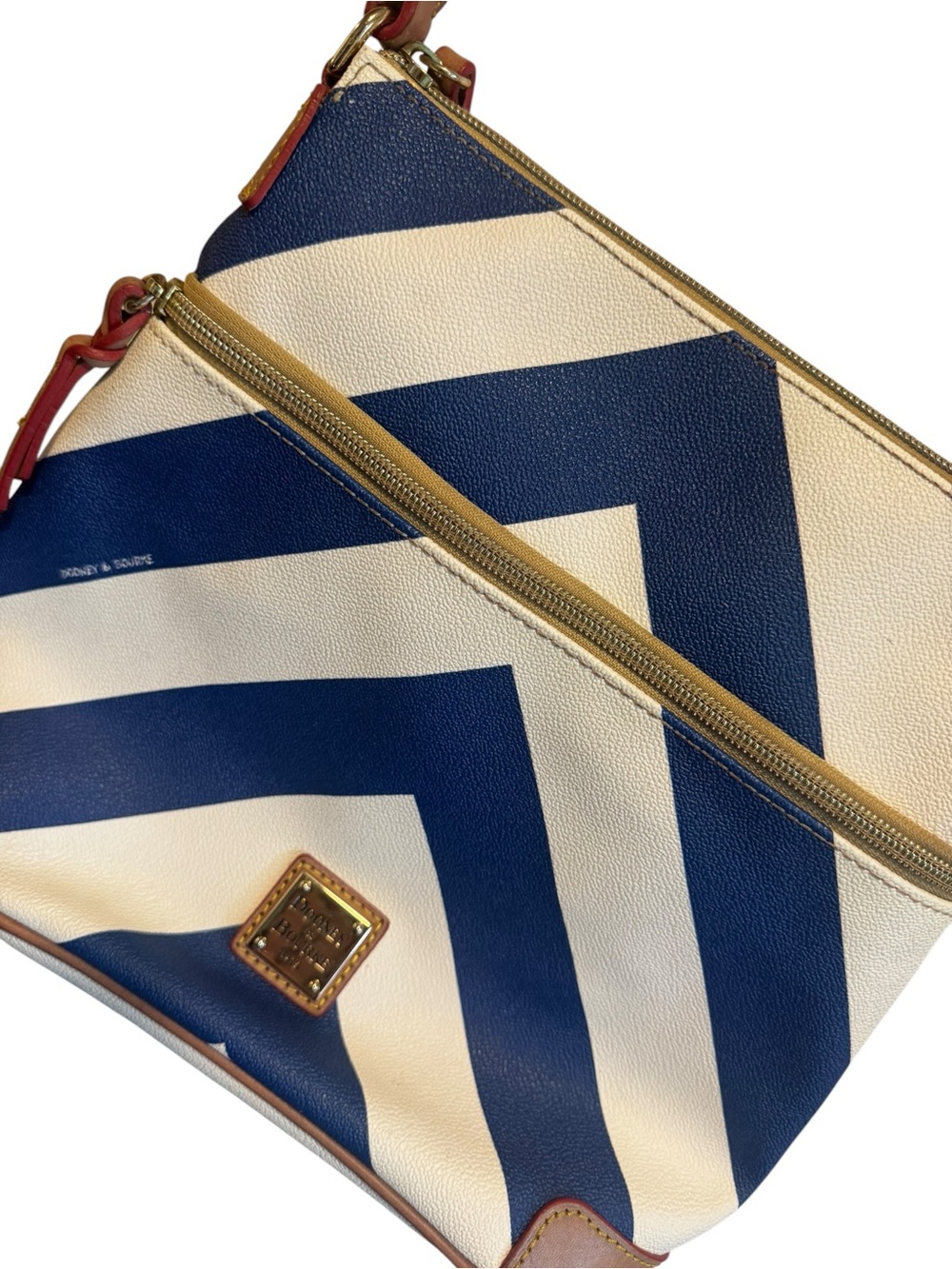 Dooney & Bourke Navy Blue and White Chevron Crossbody Pouch with Gold Trim
